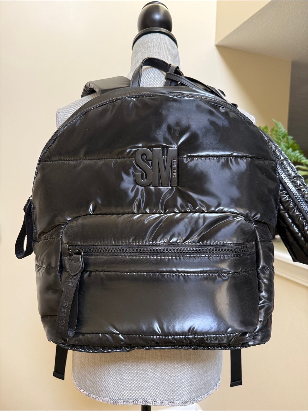 Steve Madden Black Quilted Nylon Backpack with wristlet and pass through sleeve.